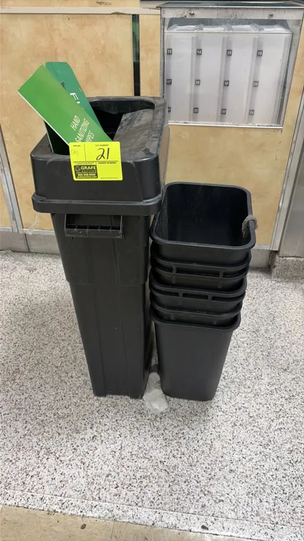 Assorted plastic trash cans. Includes (1) tall slim receptacle with open-top lid and (5) nested wastebaskets. Black plastic construction. Contents not