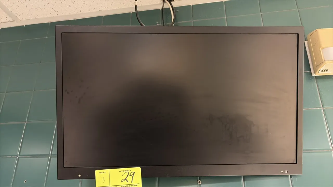 24" flat screen monitor. Features black bezel and casing. Includes wall mounting bracket.