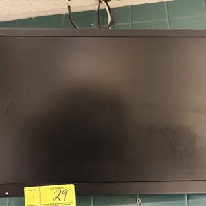 24" flat screen monitor. Features black bezel and casing. Includes wall mounting bracket.