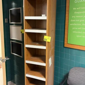 Wood laminate bookshelf. Features adjustable shelving with white front edge trim and a woodgrain finish. 15" x 16" x 88".