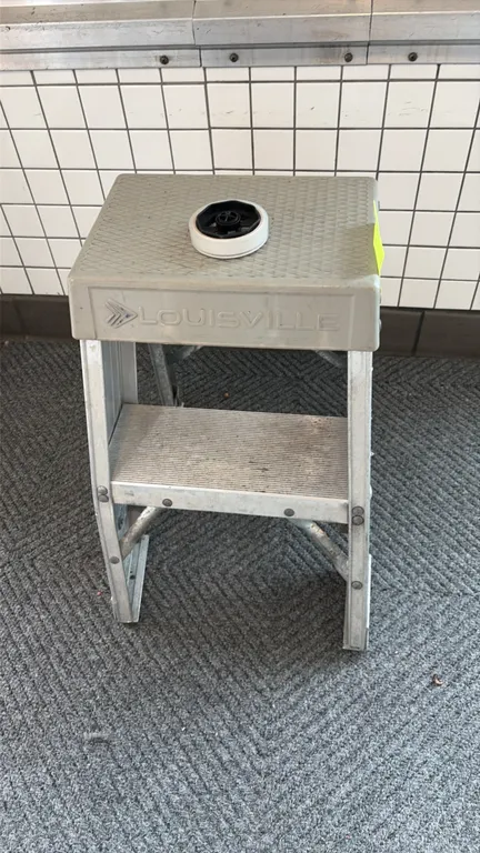 Louisville step stool. Features aluminum frame construction, molded polymer top platform with textured tread, and single slip-resistant ribbed step. N