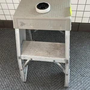 Louisville step stool. Features aluminum frame construction, molded polymer top platform with textured tread, and single slip-resistant ribbed step. N