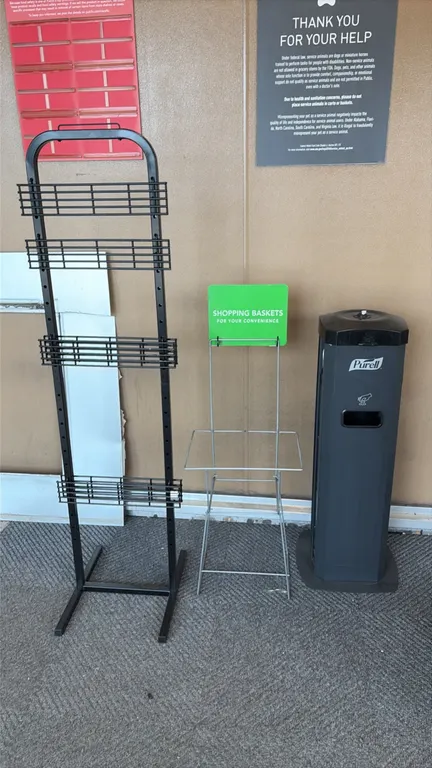 Retail store fixtures and stands. Includes metal umbrella bag stand with dual hanging hooks, 4-tier black metal wire display rack, wire shopping baske