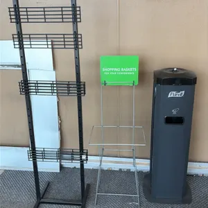 Retail store fixtures and stands. Includes metal umbrella bag stand with dual hanging hooks, 4-tier black metal wire display rack, wire shopping baske