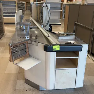 Single belt checkout lanes. Features stainless steel surfaces, conveyor belt section, bagging station with wire bag rack and folding shelf, under-coun