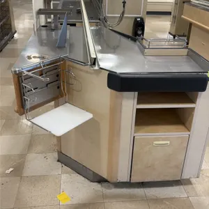 Single belt checkout lanes. Features stainless steel work surfaces, motorized conveyor belt section, bagging rack attachment, and lower storage compar