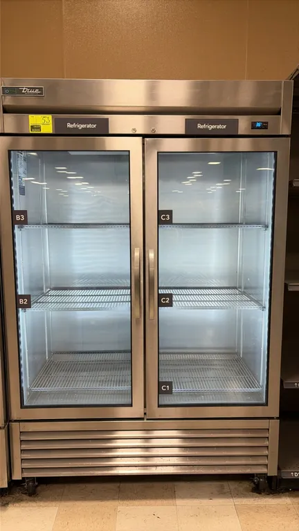 True T-49G-HC~FGD01 2-door reach-in refrigerator. Features stainless steel exterior, double-pane glass doors, adjustable wire shelving, interior LED l