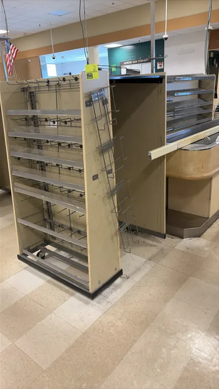 Wood laminate candy and magazine display racks. Features adjustable wire shelving, merchandise hooks, wire dividers, and side-mounted wire literature