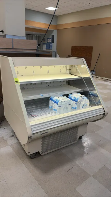 Hillphoenix O3UM44-56 self-contained reach-in service case. Features two adjustable solid upper shelves, wire bottom deck, interior lighting, and glas