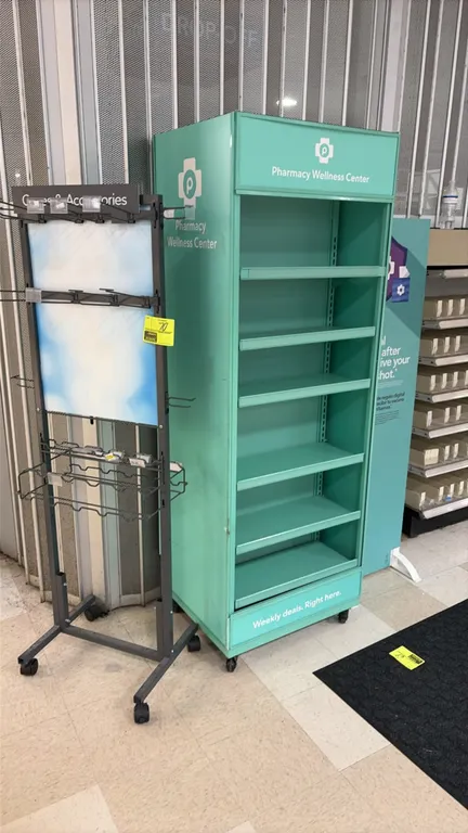 Retail mobile endcap and accessory displays. Includes a teal mobile shelving display fixture with (6) shelves and Pharmacy Wellness Center graphics, a