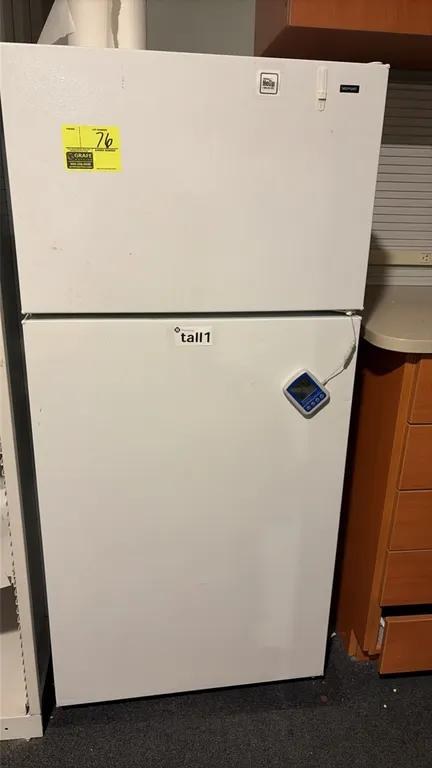 Hotpoint HTR16BBSDRWW top-freezer refrigerator. Features top-mount freezer compartment, interior wire shelving, door storage bins, dual lower crisper