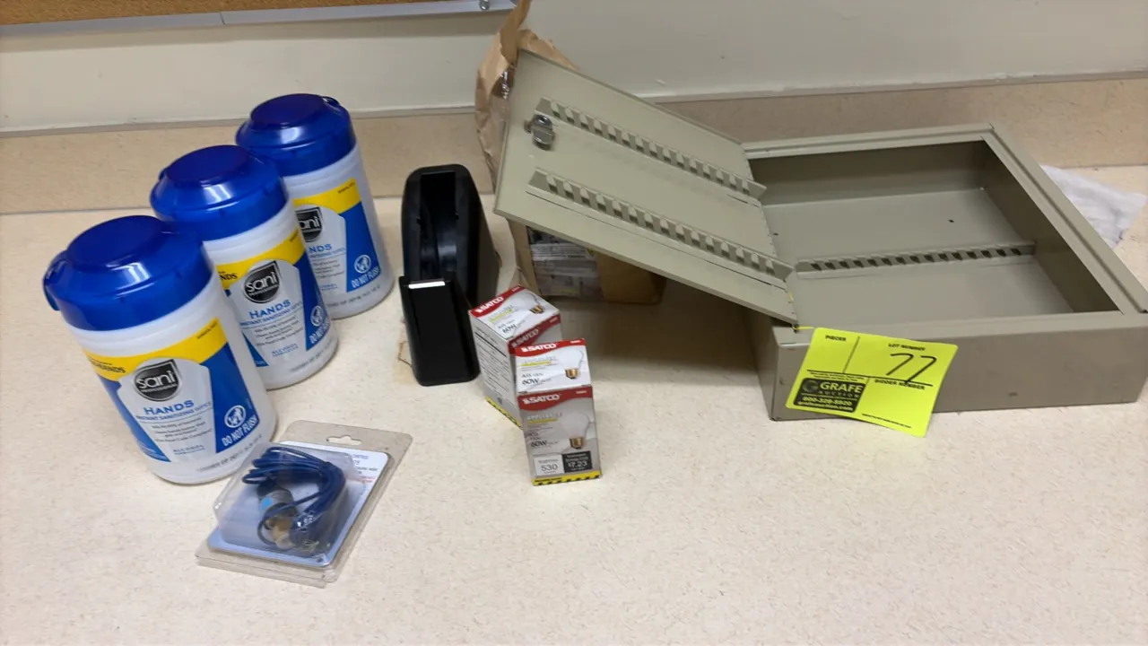 Package lot of facility supplies. Includes a wall-mountable metal key cabinet, (3) canisters of Sani Professional hand sanitizing wipes, (2) Satco 60W