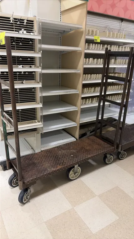 Metal U-boat carts. Features diamond plate steel platform decks and dual tall end handles. 4'L. Mounted on 6-wheel running gear with rigid center whee