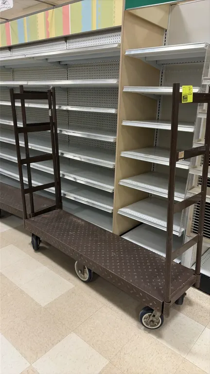 Metal U-boat carts. Features diamond-tread steel decks and dual removable upright end handles. 5'L. Mounted on 6 casters. Shelving in background not i
