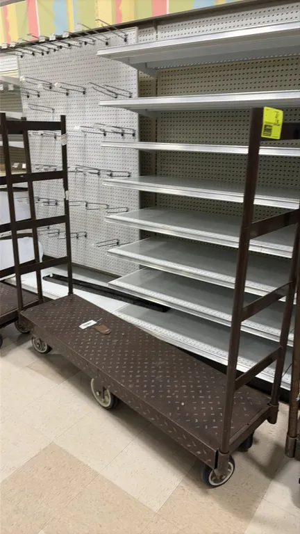 Metal U-boat carts. Features diamond plate deck and tall removable end handles. 4'L. Mounted on a 6-wheel caster configuration with rigid center wheel