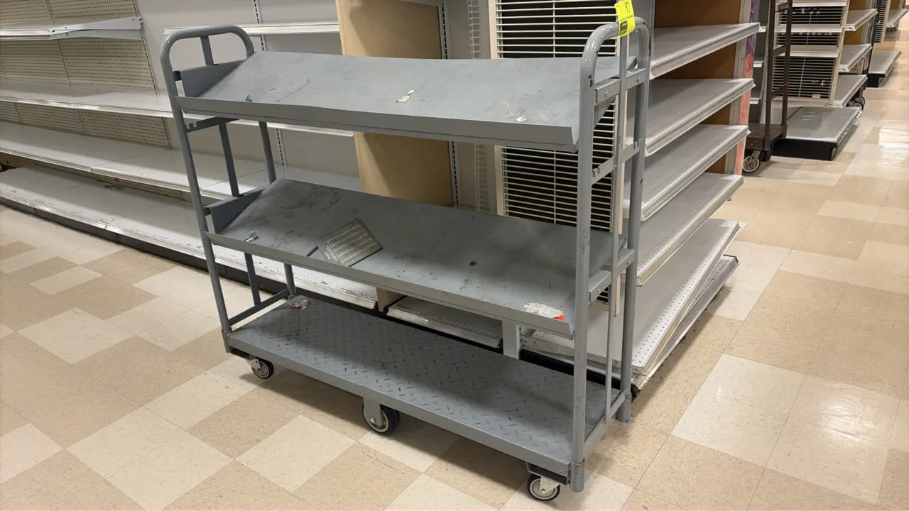Metal U-boat stock cart. Features diamond tread lower platform, (2) angled upper shelves, and tubular steel end handles. 4'L. Mounted on casters.