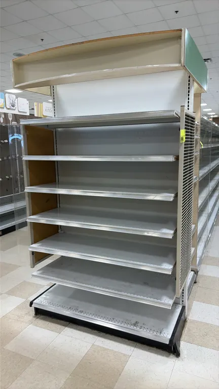 8'L of Madix end cap shelving. Features 84"H uprights, 22"D base shelves, adjustable upper metal shelves, side wire display racks, side panels, and to