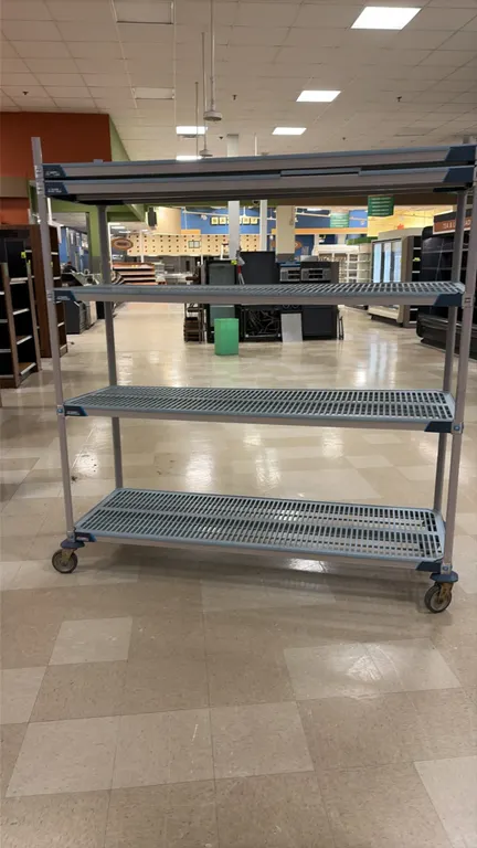 Metro MetroMax 5-tier portable shelving rack. Features adjustable tiers with vented polymer grid shelf mats. 72"L x 24"W x 80"H. Mounted on swivel cas