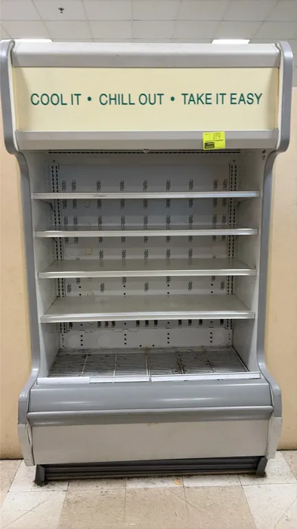 2008 Hill Phoenix ONUA4 self-contained multi-deck open display cooler. Features 4 adjustable upper shelves, bottom wire rack, and illuminated top cano