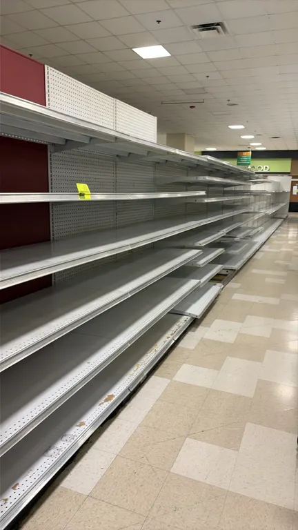 140'L of Madix gondola shelving. 72" to 76"H uprights with 22"D base shelves. Features adjustable upper metal shelves and pegboard backing. Note: Sold