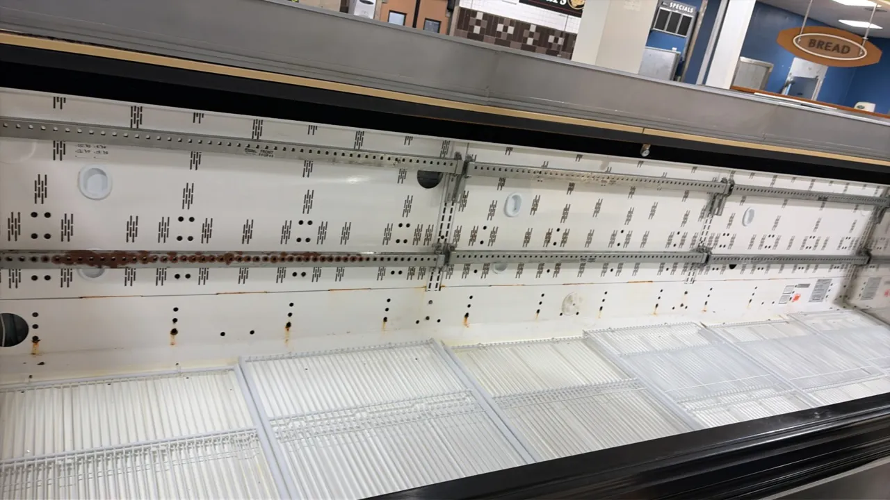 2004 Hill Phoenix O3UM12 open multi-deck deli display case. Features wire bottom deck racks and shelf bracket uprights. 12'L. Note: Upper shelves not