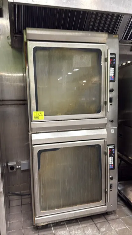 Hobart KA7EM 7-spit rotisserie ovens. Features double-stacked configuration, programmable digital controls, glass display doors, and included spits. E