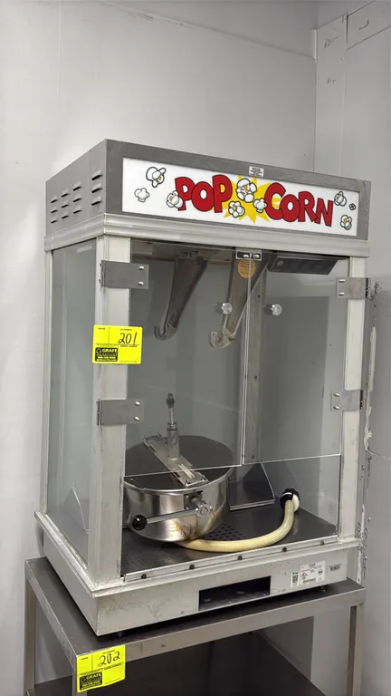 2013 Gold Medal 2001ST Citation commercial popcorn popper. Features lighted 'POPCORN' header, dual hinged glass doors, stainless steel kettle with dum