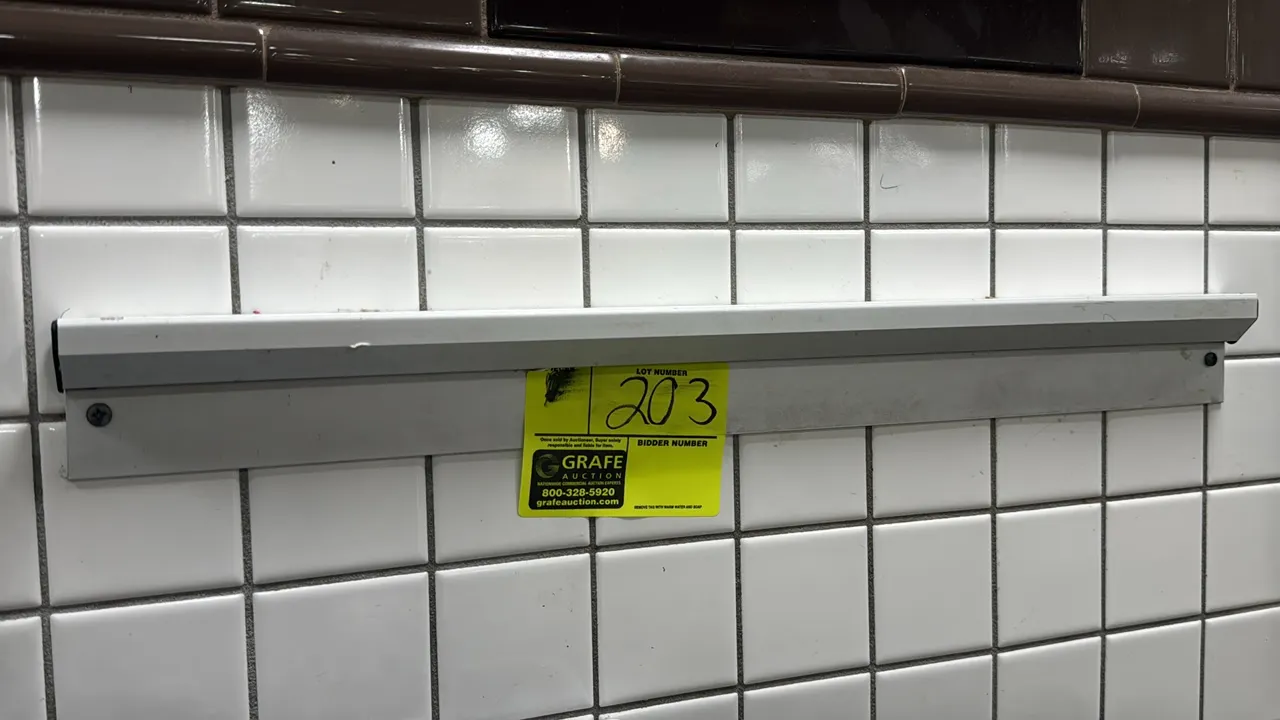Wall-mounted ticket rail. Features aluminum construction with pre-drilled mounting holes. 24"L.