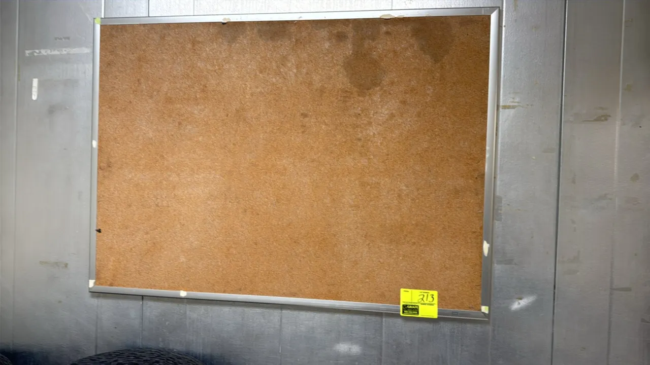 Cork bulletin board. Features an aluminum frame and natural cork tackable surface. 48" x 34".