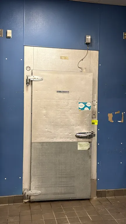Kysor walk-in cooler. Features insulated foam panels, hinged access door with kickplate, Larkin 2-fan evaporator coil, and interior lighting. Dimensio