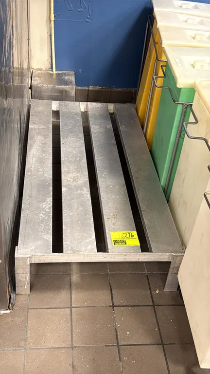 Aluminum dunnage rack. Features welded aluminum construction with a slatted top surface. 4'L. Adjacent containers and background items not included.