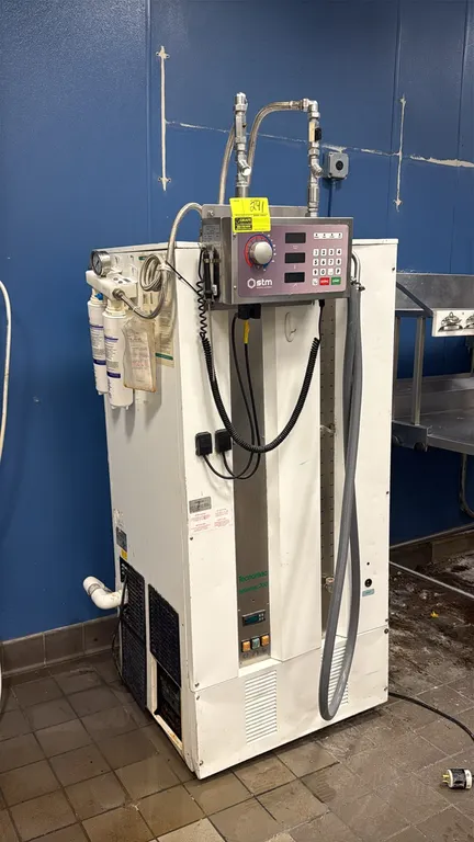 Tecnomac Aquamac 200 water chiller with STM DOMIX 45APS water meter and dispenser. Features digital control panel, integrated temperature mixing contr