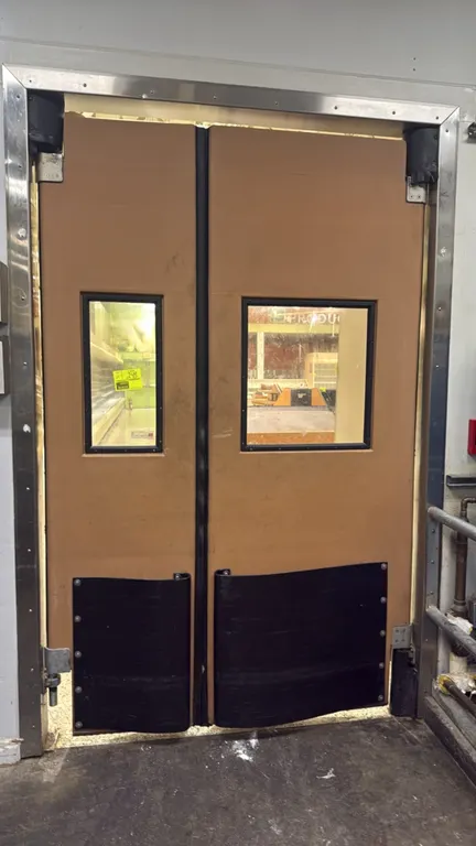 Chase polyethylene swing doors. Features clear vision panels, flexible black bottom impact bumpers, and perimeter seals. Dimensions: (1) 22"W x 91"H a