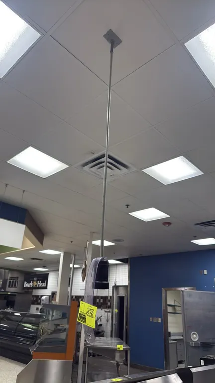Ceiling power drops. Features ceiling mounting plates, rigid conduit and flexible cord drops, and hanging electrical receptacles.