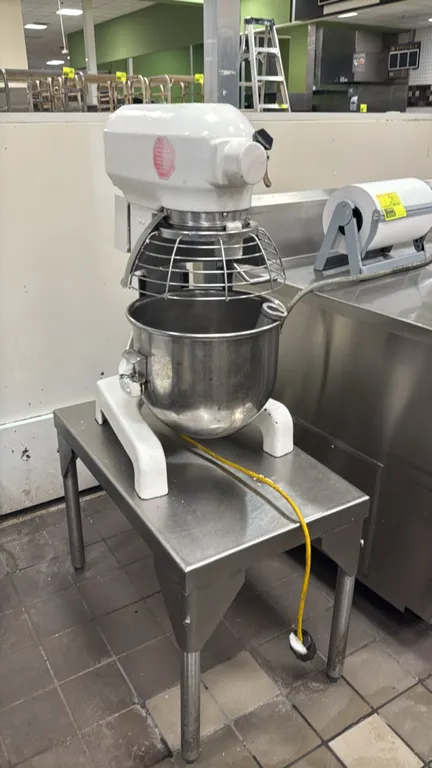 Hobart A200 20 qt planetary mixer. Includes stainless steel bowl, wire bowl guard, flat beater paddle, wire whip, and stainless steel equipment stand.
