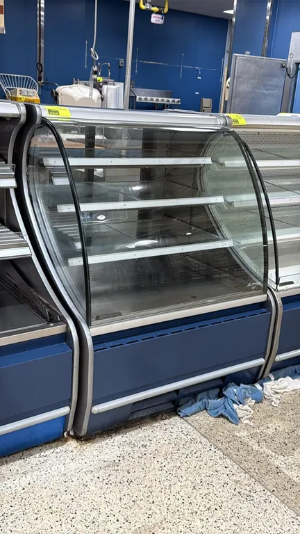Structural Concepts V38R.4394 self-contained refrigerated bakery service case. Features curved front glass, (3) glass shelves, rear sliding glass door