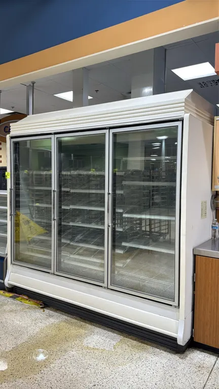 2005 Hill Phoenix ORZ3 frozen food glass doors. Features adjustable wire shelving, electric defrost, and LED interior lighting. Note: For remote refri