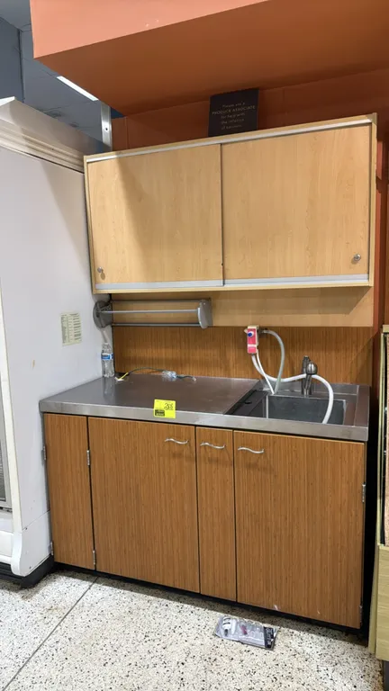 Stainless steel countertop workstation with upper and lower cabinets. Features a 49"L stainless steel worktop with integrated single-basin sink, fauce