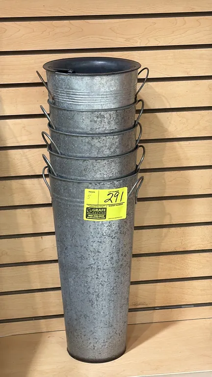 Galvanized floral pails. Features galvanized metal construction, tapered design, and dual side handles. Includes interior plastic liner.