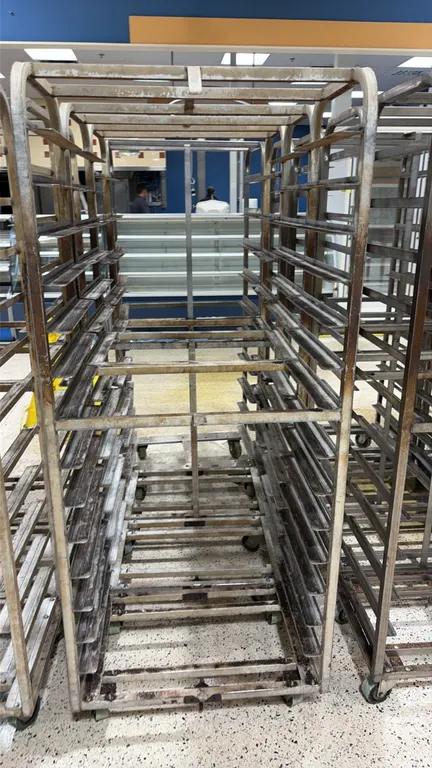 Aluminum side-load oven racks. Features aluminum construction with multi-tier side-loading pan slides. Mounted on swivel casters.