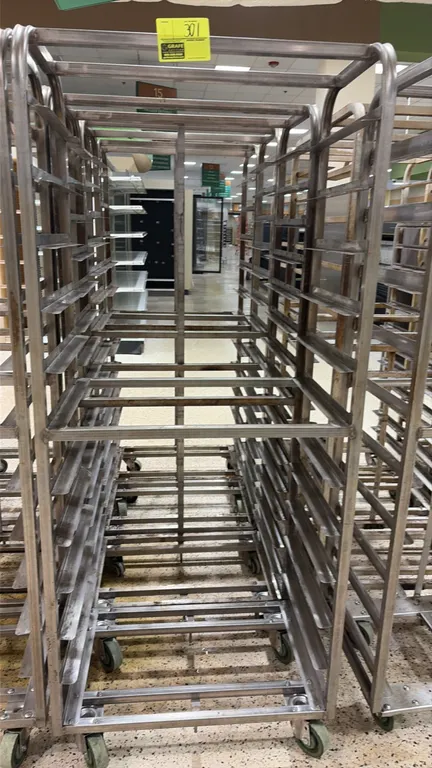 Aluminum side-load oven racks. Features welded aluminum construction with multi-tier angle slide runners. Mounted on swivel casters.