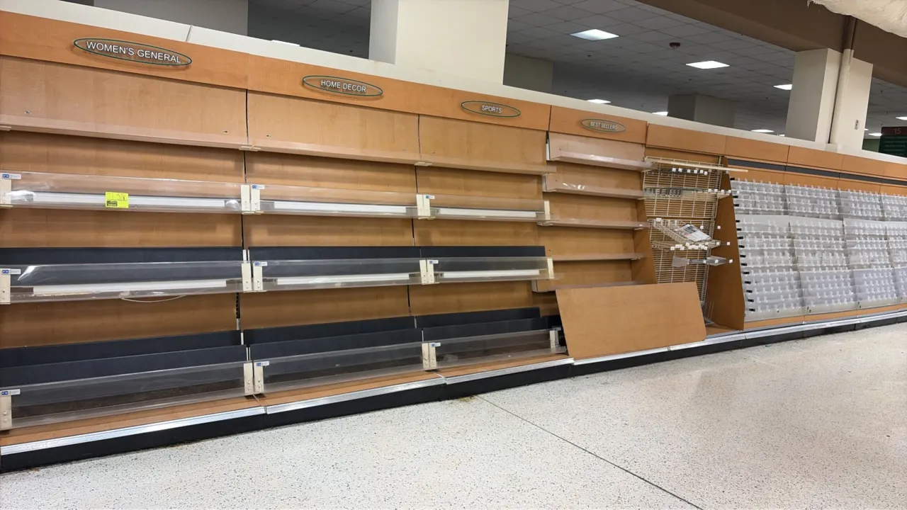 Magazine and card display racking. Features 4' sections with woodgrain laminate backing, category headers, tiered greeting card displays, and magazine