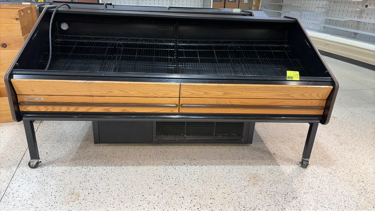 2011 Southern Store Fixtures FLX-8' self-contained refrigerated produce display case. Features woodgrain front panel trim, black interior with wire ra