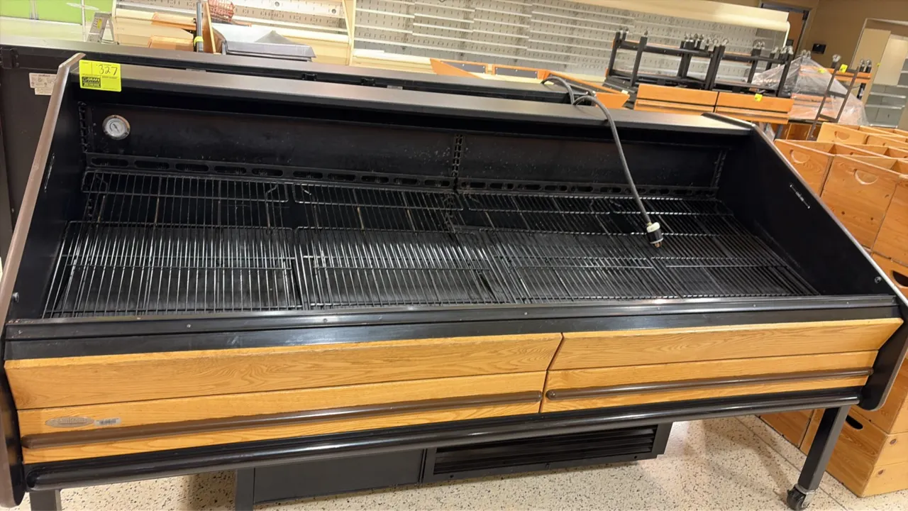 2011 Southern Store Fixtures FLX-8' self-contained refrigerated produce display case. Features black wire deck racks, analog temperature gauge, and wo