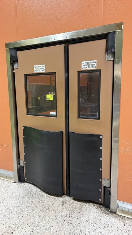 Polyethylene swing doors. Features vision panels and lower black impact bumper plates. Dimensions: 34"W x 80"H and 22"W x 80"H panels. Includes stainl