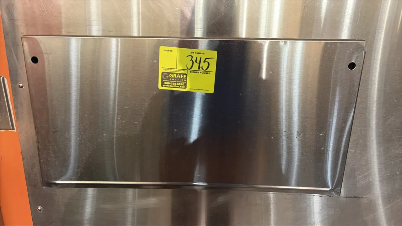 Stainless steel knife holder. Features wall-mount design with pre-drilled mounting holes and open top slot for cutlery storage.