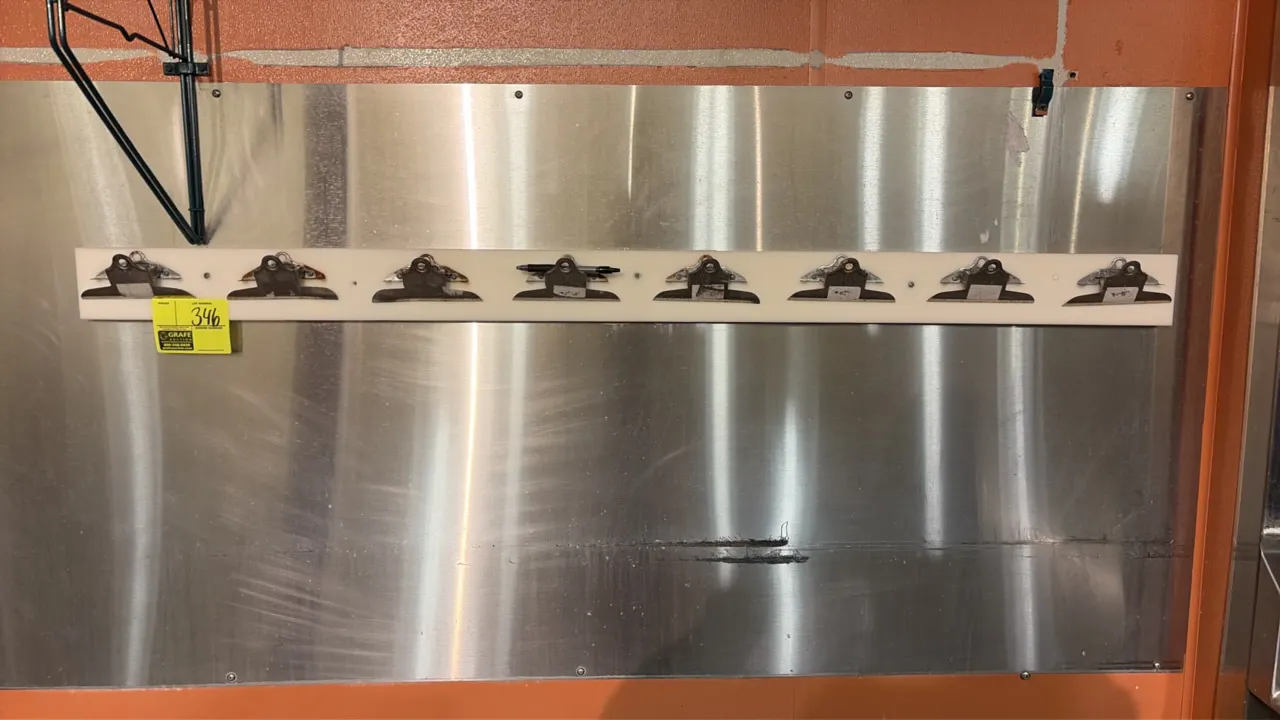 Poly clipboard holder. Features (8) spring-loaded clipboard clips mounted on a white polyethylene bar. 5'L. Wall-mount design. Stainless steel wall pa