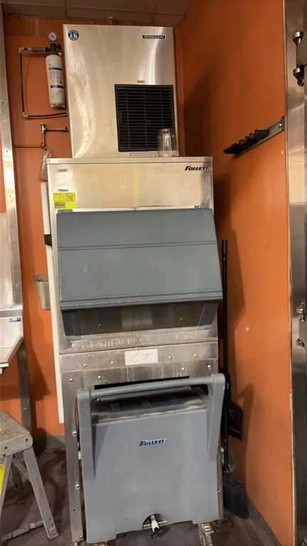 Hoshizaki F-801MAH ice machine with Follett ice bin and mobile ice caddy. Features stainless steel construction, front ventilation, and gravity dispen