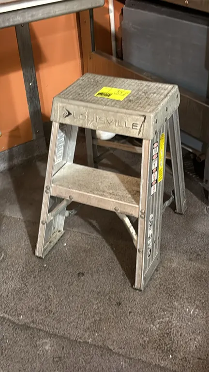 Louisville aluminum stepladder. Features folding design with textured top platform. 2'H.