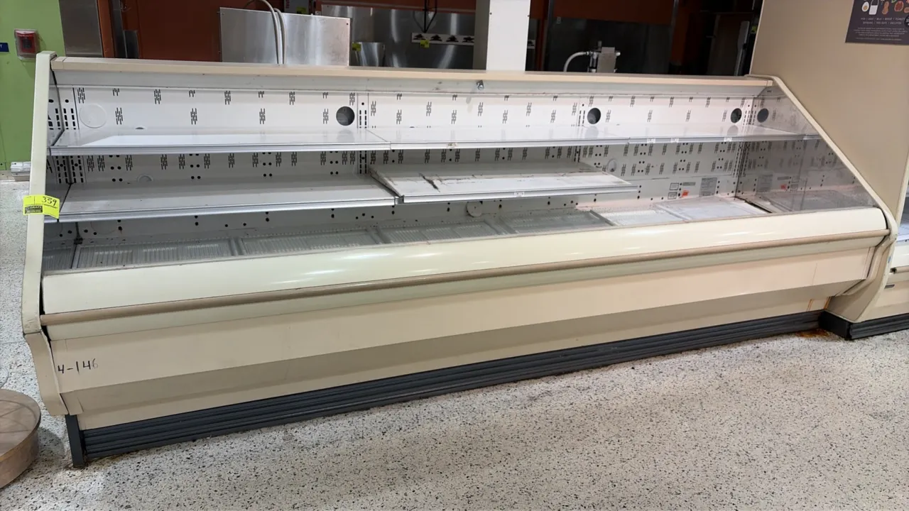 2004 Hill Phoenix O3UM12 open produce display case. Features tiered shelving, open-front design, and lower bumper guard. 12'L. Electrical: 115V / 208-
